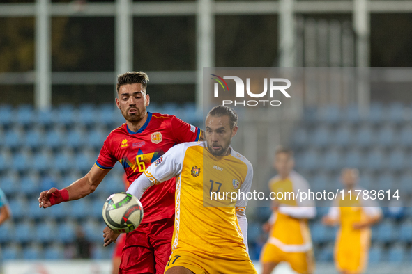 Christian Gonzalez of Andorra and Victor Mudrac of Moldova compete for the ball during the UEFA Nations League 2024 - League phase - Matchda...