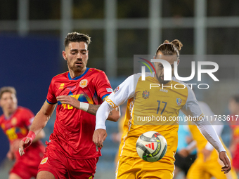 Christian Gonzalez of Andorra and Victor Mudrac of Moldova compete for the ball during the UEFA Nations League 2024 - League phase - Matchda...