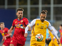 Christian Gonzalez of Andorra and Victor Mudrac of Moldova compete for the ball during the UEFA Nations League 2024 - League phase - Matchda...