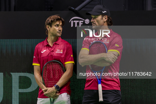 In Malaga, Spain, on November 16, 2024, Carlos Moya of Spain and David Ferrer, captain of Spain, participate in a training session in prepar...