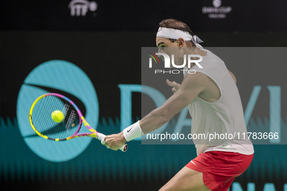 Rafael Nadal of Spain plays backwards during a Spain training session in preparation for the Davis Cup tie against the Netherlands at Palaci...