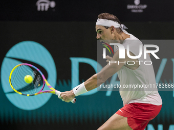 Rafael Nadal of Spain plays backwards during a Spain training session in preparation for the Davis Cup tie against the Netherlands at Palaci...