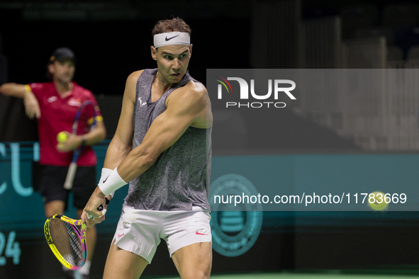 Rafael Nadal of Spain plays backwards during a Spain training session in preparation for the Davis Cup tie against the Netherlands at Palaci...