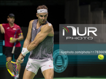 Rafael Nadal of Spain plays backwards during a Spain training session in preparation for the Davis Cup tie against the Netherlands at Palaci...