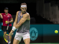 Rafael Nadal of Spain plays backwards during a Spain training session in preparation for the Davis Cup tie against the Netherlands at Palaci...