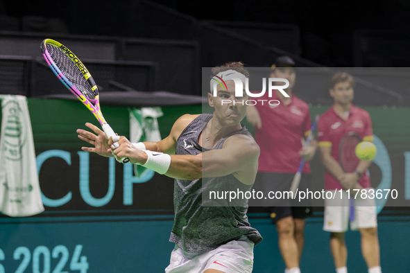 Rafael Nadal of Spain plays backwards during a Spain training session in preparation for the Davis Cup tie against the Netherlands at Palaci...