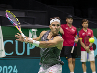 Rafael Nadal of Spain plays backwards during a Spain training session in preparation for the Davis Cup tie against the Netherlands at Palaci...