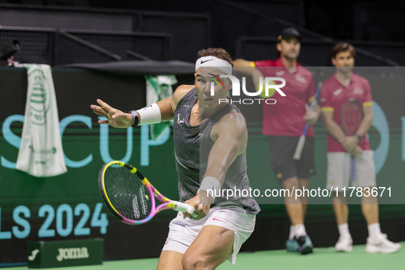 Rafael Nadal of Spain plays backwards during a Spain training session in preparation for the Davis Cup tie against the Netherlands at Palaci...