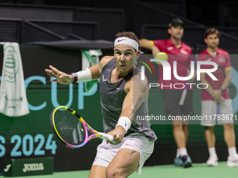 Rafael Nadal of Spain plays backwards during a Spain training session in preparation for the Davis Cup tie against the Netherlands at Palaci...