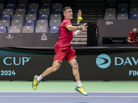 In Malaga, Spain, on November 16, 2024, Roberto Bautista of Spain plays a forehand during a Spain training session in preparation for the Da...