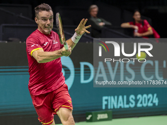 In Malaga, Spain, on November 16, 2024, Roberto Bautista of Spain plays a forehand during a Spain training session in preparation for the Da...