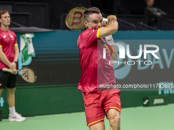 In Malaga, Spain, on November 16, 2024, Roberto Bautista of Spain plays a forehand during a Spain training session in preparation for the Da...