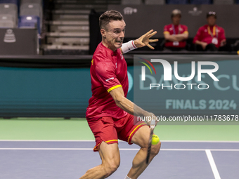 In Malaga, Spain, on November 16, 2024, Roberto Bautista of Spain plays a forehand during a Spain training session in preparation for the Da...