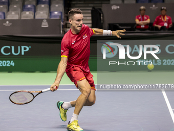 In Malaga, Spain, on November 16, 2024, Roberto Bautista of Spain plays a forehand during a Spain training session in preparation for the Da...