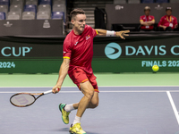 In Malaga, Spain, on November 16, 2024, Roberto Bautista of Spain plays a forehand during a Spain training session in preparation for the Da...