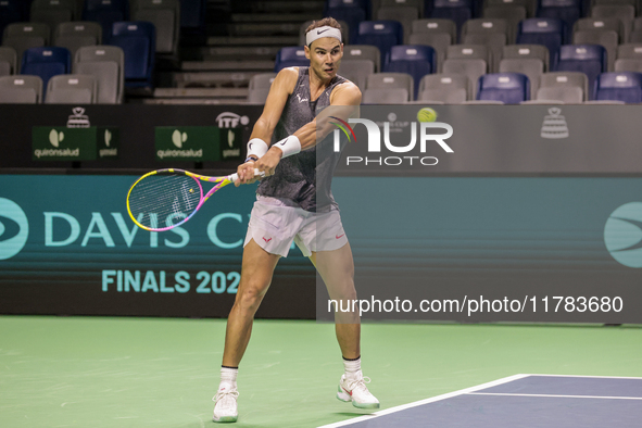 Rafael Nadal of Spain plays backwards during a Spain training session in preparation for the Davis Cup tie against the Netherlands at Palaci...