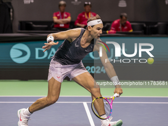 Rafael Nadal of Spain plays backwards during a Spain training session in preparation for the Davis Cup tie against the Netherlands at Palaci...