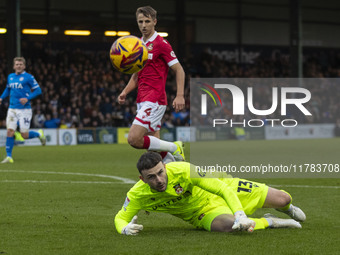 Callum Burton #13 (GK) of Wrexham A.F.C. makes a save during the Sky Bet League 1 match between Stockport County and Wrexham at the Edgeley...