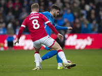 Ethan Pye #15 of Stockport County F.C. is challenged by Andy Cannon #8 of Wrexham A.F.C. during the Sky Bet League 1 match between Stockport...