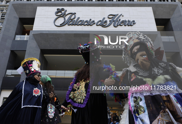 Dancers dressed in chinelos accompany residents of the town of Xoco in Coyoacan, Mexico City, on November 16, 2024, as they protest outside...