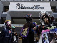 Dancers dressed in chinelos accompany residents of the town of Xoco in Coyoacan, Mexico City, on November 16, 2024, as they protest outside...