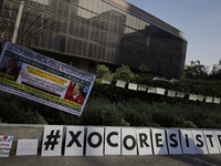 Residents of the town of Xoco in Coyoacan, Mexico City, place signs and banners outside the Mitikah shopping mall to protest the constructio...