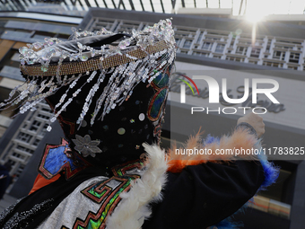 Dancers dressed in chinelos accompany residents of the town of Xoco in Coyoacan, Mexico City, on November 16, 2024, as they protest outside...