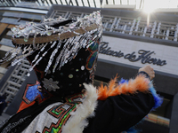 Dancers dressed in chinelos accompany residents of the town of Xoco in Coyoacan, Mexico City, on November 16, 2024, as they protest outside...