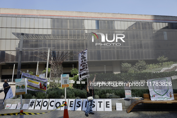 Residents of the town of Xoco in Coyoacan, Mexico City, place signs and banners outside the Mitikah shopping mall to protest the constructio...