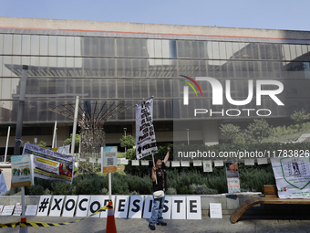 Residents of the town of Xoco in Coyoacan, Mexico City, place signs and banners outside the Mitikah shopping mall to protest the constructio...