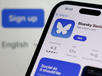 Bluesky Social website displayed on a laptop screen and Bluesky Social on App Store displayed on a phone screen are seen in this illustratio...