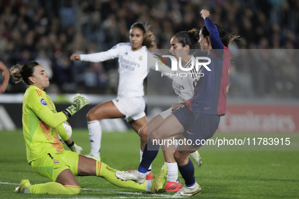 Aitana Bonmati of FC Barcelona and Misa of Real Madrid are in action during the LIGA F match between Real Madrid and FC Barcelona at Alfredo...