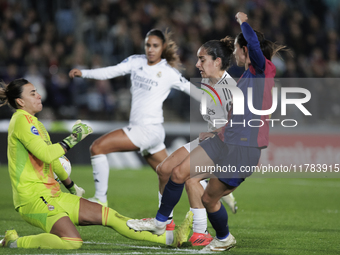 Aitana Bonmati of FC Barcelona and Misa of Real Madrid are in action during the LIGA F match between Real Madrid and FC Barcelona at Alfredo...