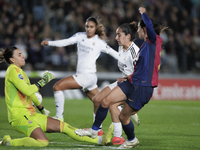 Aitana Bonmati of FC Barcelona and Misa of Real Madrid are in action during the LIGA F match between Real Madrid and FC Barcelona at Alfredo...