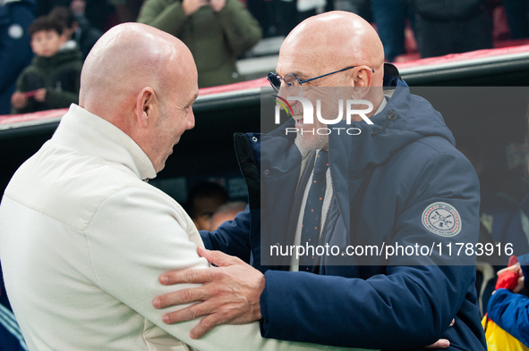 In Copenhagen, Denmark, on November 15, 2024, Brian Riemer, the head coach of Denmark, greets Luis de la Fuente, the head coach of Spain, be...