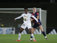 Naomie Feller of Real Madrid and Mapi Leon of FC Barcelona fight for the ball during the LIGA F match between Real Madrid and FC Barcelona a...