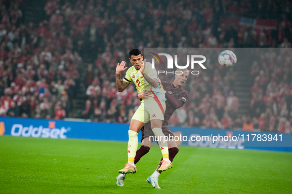 On November 15, 2024, in Copenhagen, Denmark, Pedro Porro of Spain fights for the ball with Albert Gronbeak of Denmark during the Nations Le...