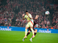 On November 15, 2024, in Copenhagen, Denmark, Pedro Porro of Spain fights for the ball with Albert Gronbeak of Denmark during the Nations Le...