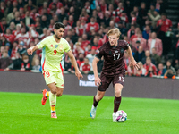 Victor Kristiansen of Denmark controls the ball during the Nations League Round 5 match between Denmark and Spain at Parken Stadium in Copen...