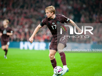 Victor Kristiansen of Denmark controls the ball during the Nations League Round 5 match between Denmark and Spain at Parken Stadium in Copen...