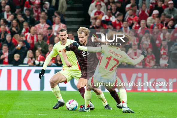 Morten Hjulmand of Denmark fights for the ball with Marc Cucurella of Spain during the Nations League Round 5 match between Denmark and Spai...