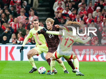 Morten Hjulmand of Denmark fights for the ball with Marc Cucurella of Spain during the Nations League Round 5 match between Denmark and Spai...