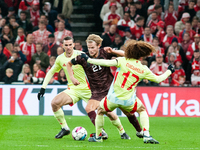 Morten Hjulmand of Denmark fights for the ball with Marc Cucurella of Spain during the Nations League Round 5 match between Denmark and Spai...