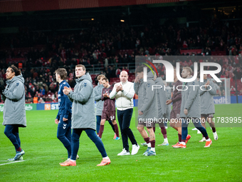 On November 15, 2024, in Copenhagen, Denmark, Brian Riemer, the head coach of Denmark, talks with Christian Norgaard of Denmark at full time...