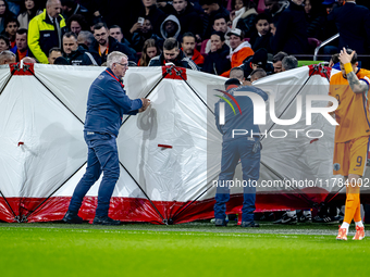 A medical assistant is with the assistant trainer of Hungary during the match between the Netherlands and Hungary at the Johan Cruijff ArenA...