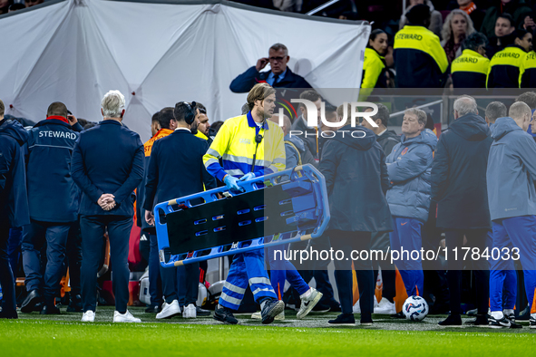 A medical assistant is with the assistant trainer of Hungary during the match between the Netherlands and Hungary at the Johan Cruijff ArenA...