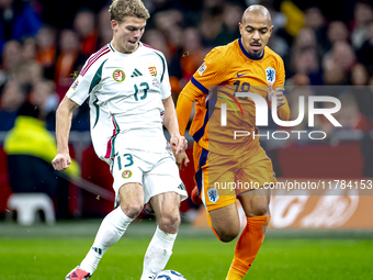 Hungary midfielder Andras Schafer and Netherlands forward Donyell Malen participate in the match between the Netherlands and Hungary at the...