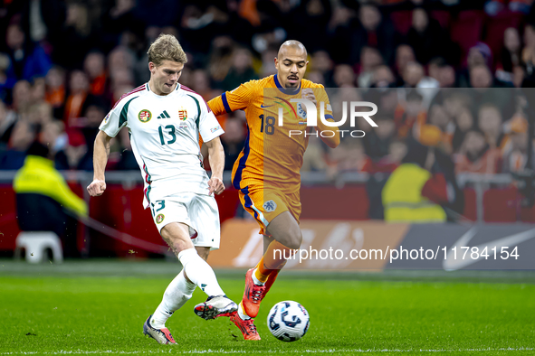 Hungary midfielder Andras Schafer and Netherlands forward Donyell Malen participate in the match between the Netherlands and Hungary at the...