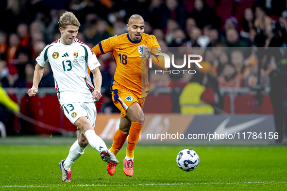 Hungary midfielder Andras Schafer and Netherlands forward Donyell Malen participate in the match between the Netherlands and Hungary at the...