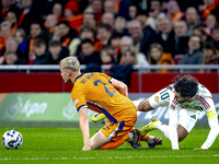 Netherlands defender Jan-Paul van Hecke and Hungary midfielder Dominik Szoboszlai participate in the match between the Netherlands and Hunga...